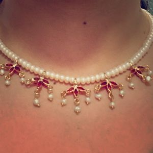 Pearl Necklace set with golden touch and red stone